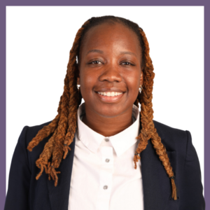 Portrait of a person with long braided hair wearing a navy blazer and white collared shirt. They are smiling and facing the camera against a plain white background with a purple border.