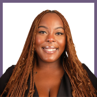 A smiling person with long braided hair and a nose ring is pictured against a plain white background. They are wearing a black top, and the image is framed with a purple border.