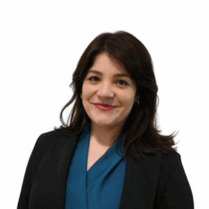 A woman with shoulder-length dark hair wearing a teal blouse and a black blazer, smiling at the camera against a plain white background.