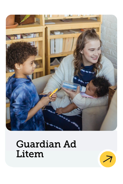A woman sitting in an armchair holds a baby while smiling at a young boy standing nearby. They are in a room with bookshelves. The text below reads "Guardian Ad Litem" with a yellow arrow.