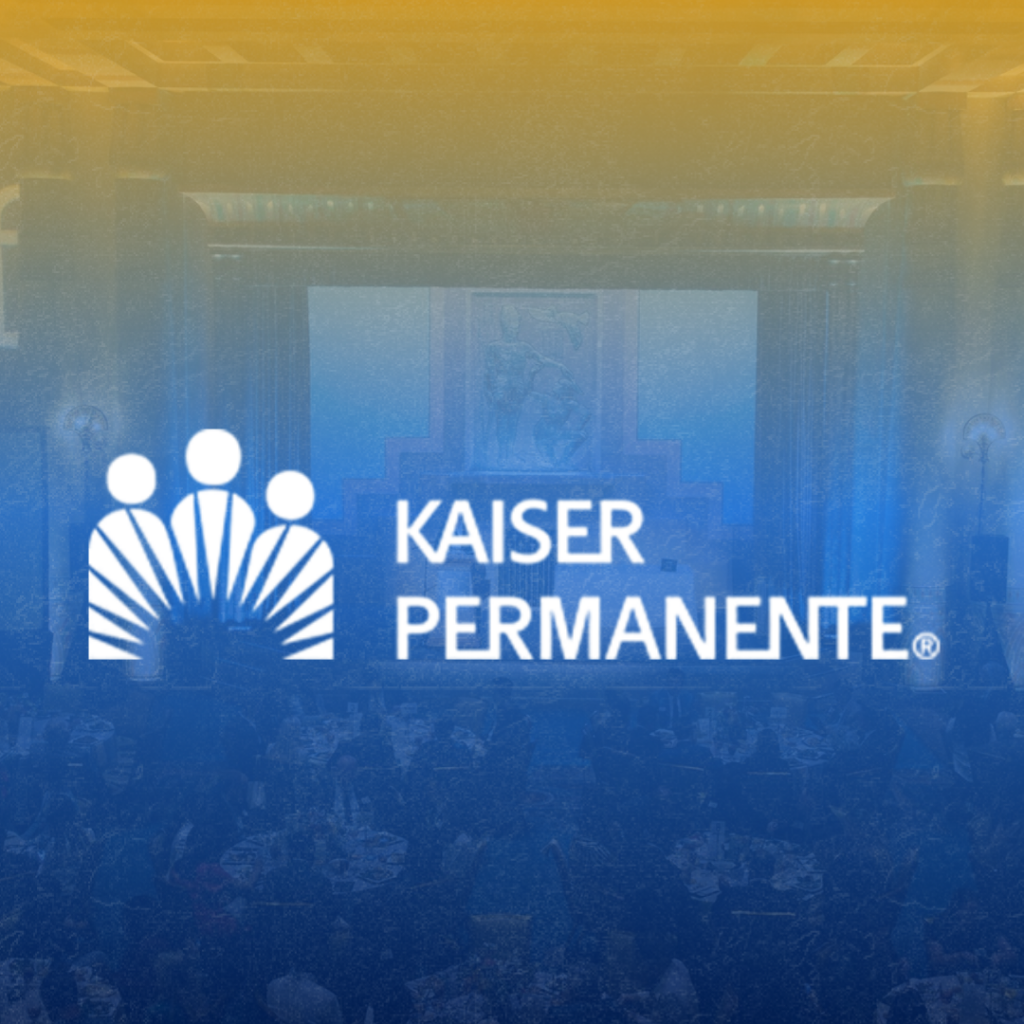White Kaiser Permanente logo and name centered on an image of a conference or banquet hall filled with people, overlaid with a blue and yellow gradient.