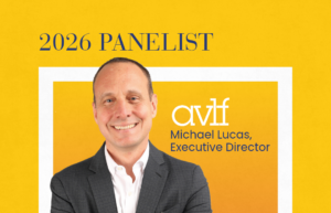 A smiling man in a suit stands with arms crossed next to text: “2026 Panelist, AVLF, Michael Lucas, Executive Director.” Below is the Crossroads Dignity Forum logo on a yellow background.